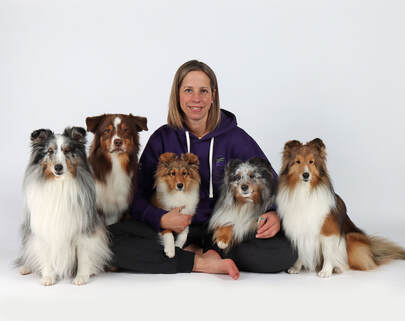 Carolyn McIntyre with her five dogs